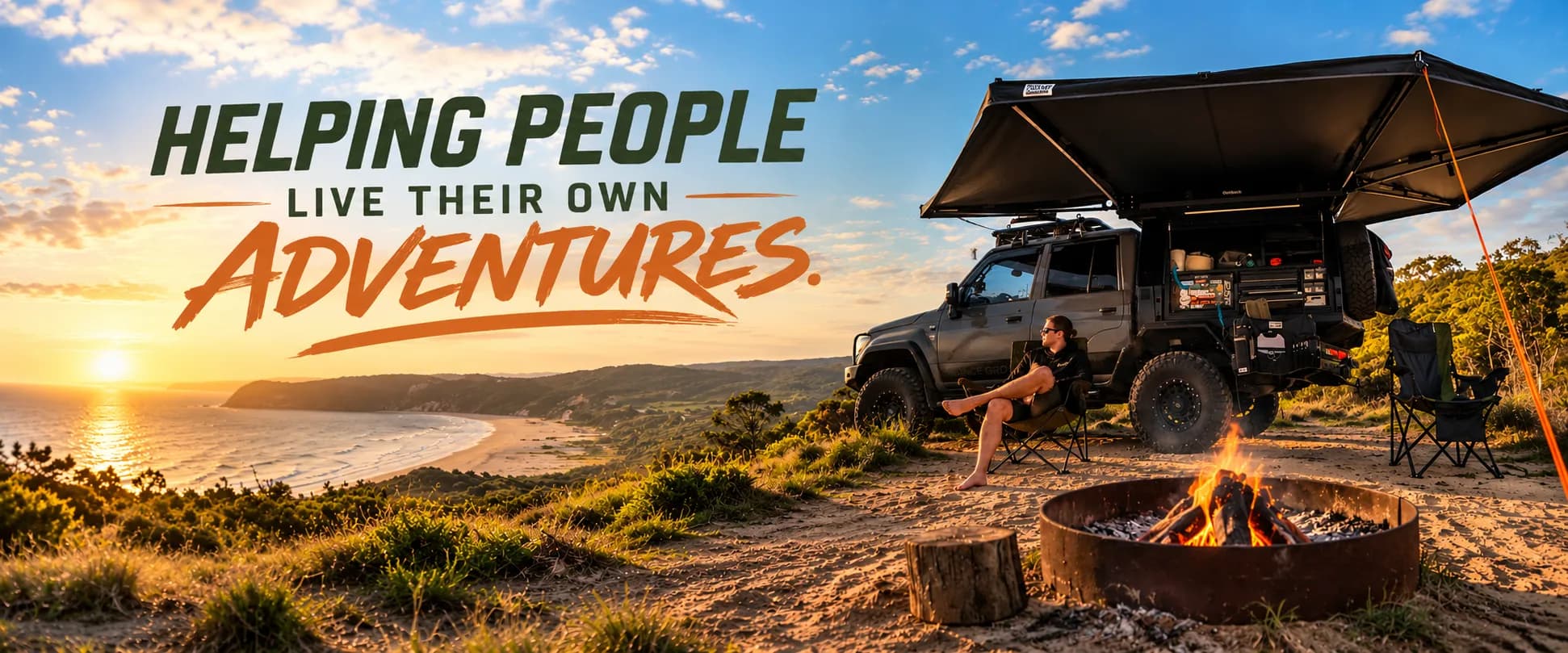 Helping people live their own adventures: a touring 4x4 with its awning out at a clifftop beach camp at sunset, a man relaxing in a camp chair beside a campfire